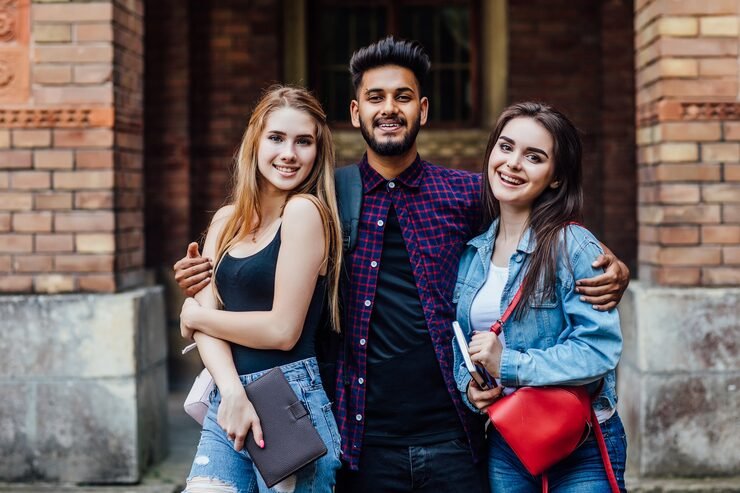 hugs standing university good mood intelligence happy students standing together outside 496169 107